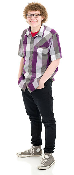 Happy Teenage Boy Standing Portrait Portrait of a teenage boy on a white background. http://s3.amazonaws.com/drbimages/m/ih.jpg nerd stock pictures, royalty-free photos & images