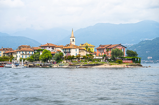 View on Isola dei Pescatori, in Lake Maggiore, in Northern Italy (great lakes region). The Borromean Islands are a group of islands that include Isola Bella, Isola dei Pescatori, and Isola Madre which can be visited.  July 23, 2023.