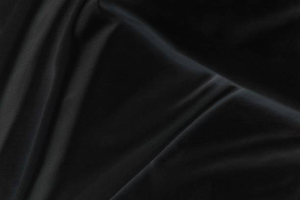 istock Smooth elegant black silk fabric or satin luxury cloth texture for abstract background 1732521459