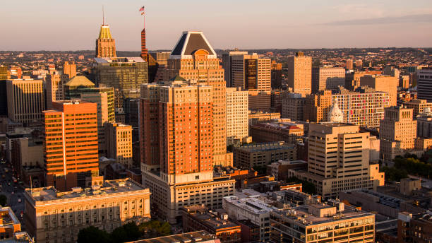 istock Baltimore, MD Downtown District at sunrise: skyscrapers and office buildings in Inner Baltimore meet dawn. Aerial view, urban skyline 1732521632