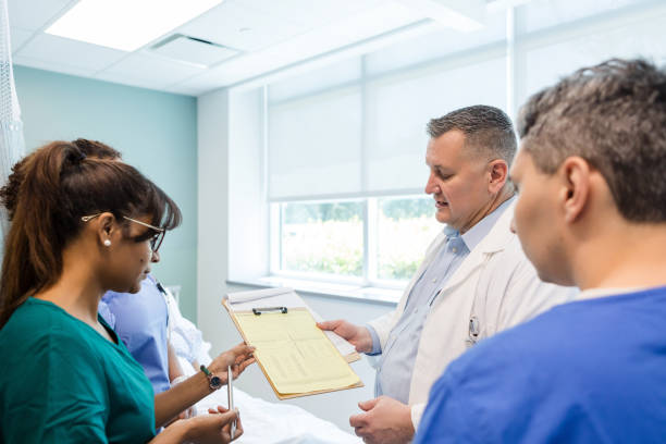 istock Male surgeon talks with his colleagues about department changes 1732521724