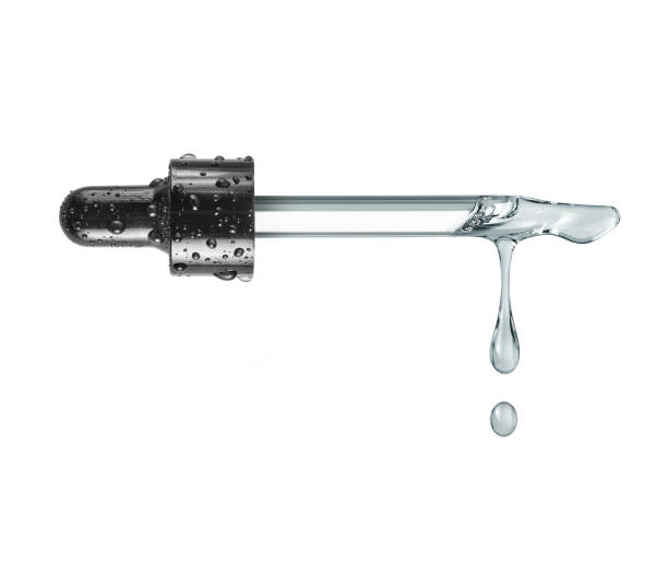 istock Oily drops dripping from a cosmetic pipette close up isolated on a white background 1732521784