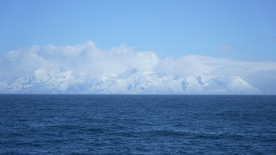 snow-covered coast of Antarctica, beautiful view from the sea