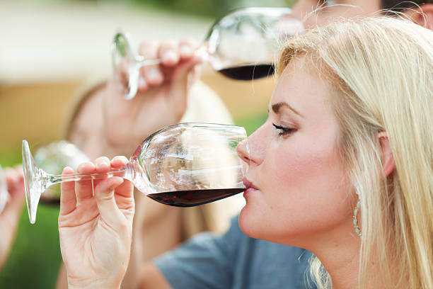 istock Winetasting Woman and Man Drinking, Sipping, Tasting Winery Red Wine 173253284
