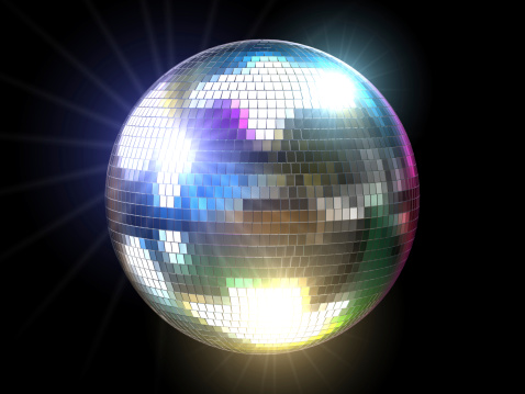 A three-dimensional disco ball with colored reflections and flares over black background.