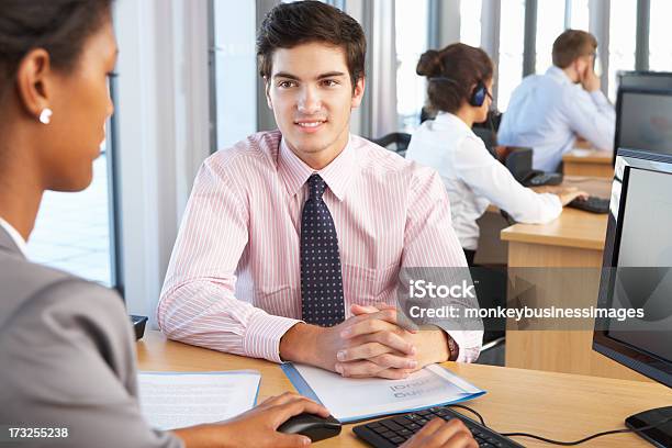 Two Coworkers Siting In A Desk At Work Stock Photo - Download Image Now - Adult, African Ethnicity, African-American Ethnicity