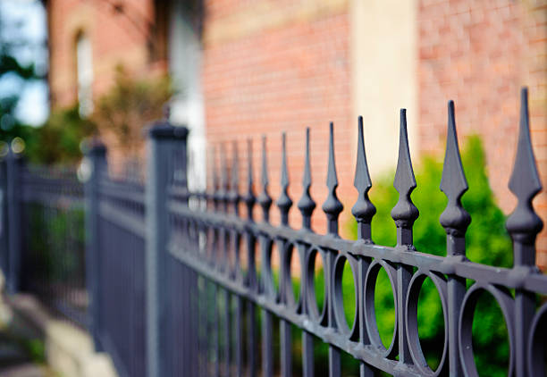 istock Black iron fence with arrowhead spikes 173255303