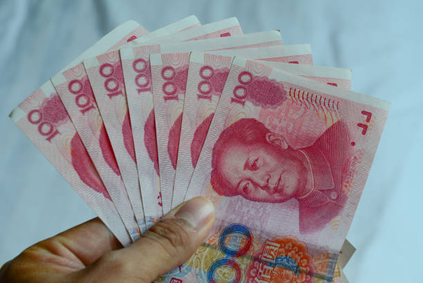100 Renminbi (RMB) banknotes 100 Renminbi (RMB) banknotes closed up. mao original stock pictures, royalty-free photos & images