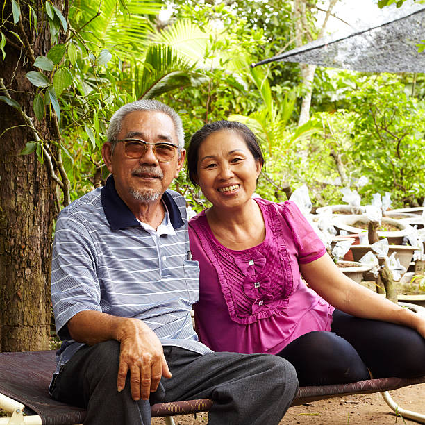 Senior Asian couple smiling together stock photo