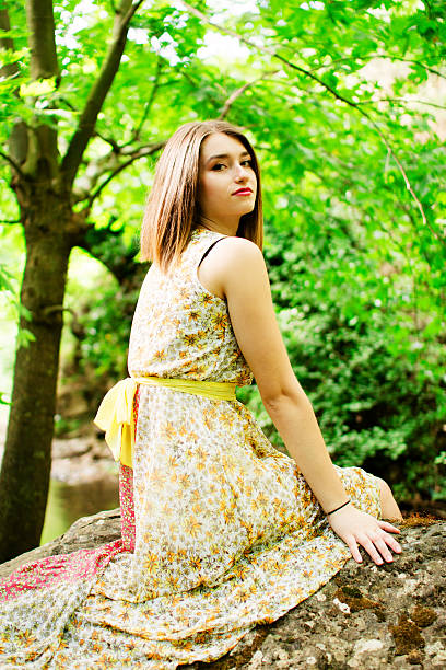 istock Girl sitting on the rock 173256889
