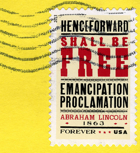 Freedom Postage Stamp Postmarked stamp with the words "Henceforward Shall Be Free Emancipation Proclamation Abraham Lincoln 1863". Forever USA. Stamp is on a yellow background with copy space. emancipation proclamation stock pictures, royalty-free photos & images