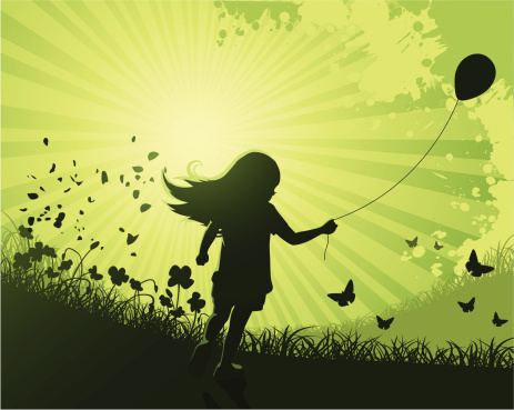 Cute girl running with a baloon on nature background.