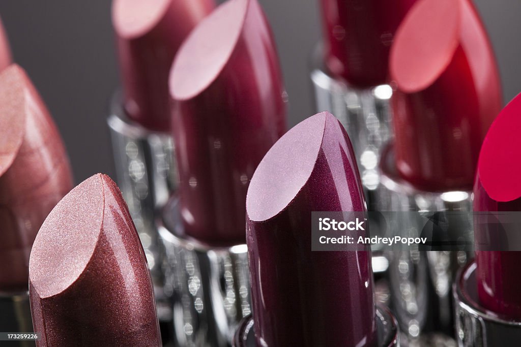 Lipsticks In A Row Lipsticks In A Row Isolated Over Gray Background Artist's Palette Stock Photo