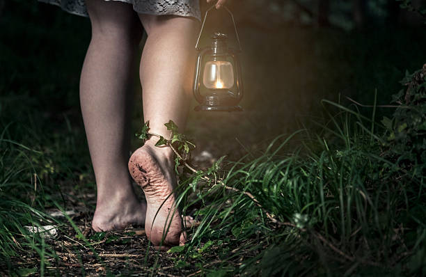 istock Barefoot woman with lantern in the forest 173259614