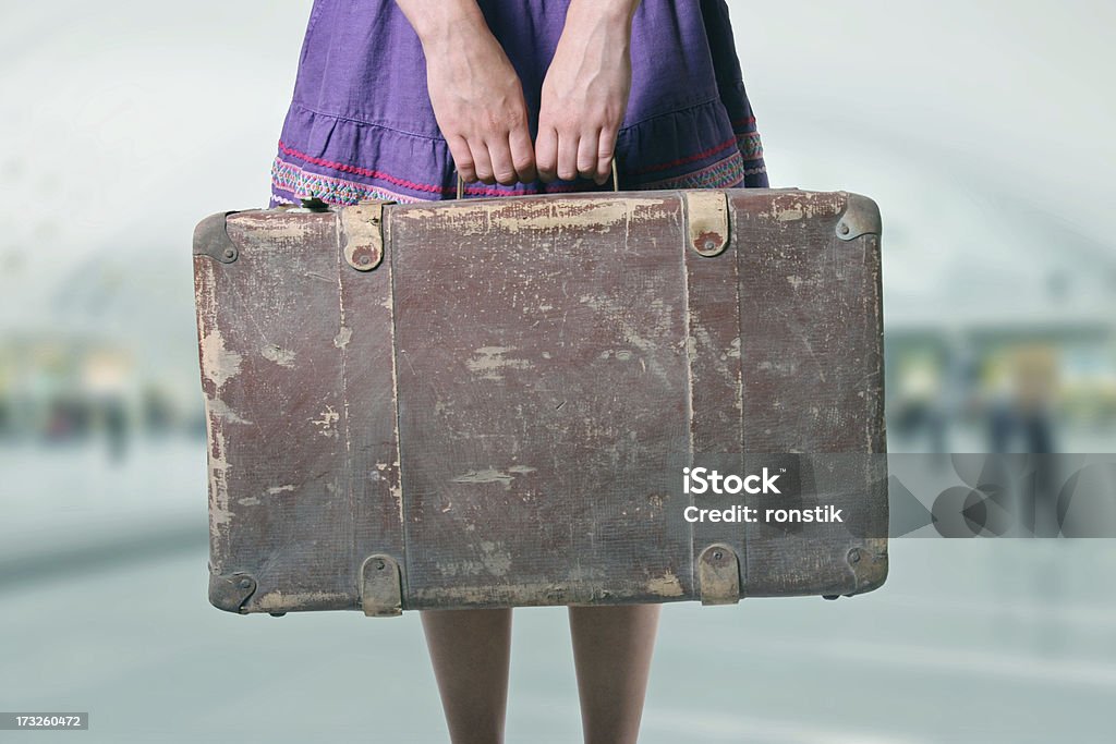 woman with luggage at the airport woman with retro luggage at the airport Adult Stock Photo