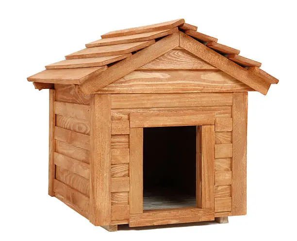 Photo of Dog kennel fashioned out of raw redwood planks