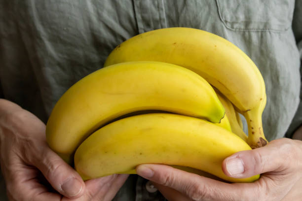 istock banana in hand 1732624472