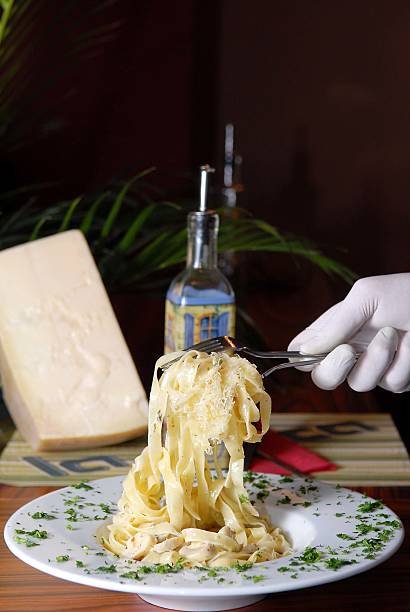 istock Waiter serving italian past in fancy restaurant 173264079