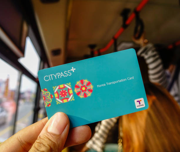 Passenger showing CityPass Card Seoul, South Korea - Feb 6, 2015. Passenger showing CityPass Card on Seoul public bus. The card can be use many public transport in South Korea. seoul bus stock pictures, royalty-free photos & images