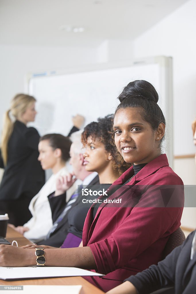 Aboriginal Woman In a Meeting Aboriginal woman in a business meeting Office Stock Photo