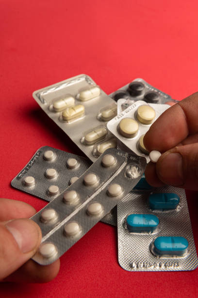 istock addict hands handling pills. drug addiction concept. (series). 1732687541