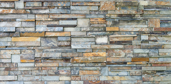 Granite Stone wall background texture. Dry masonry wall