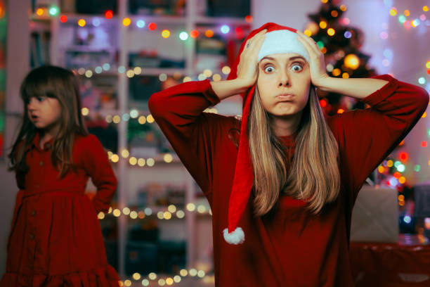 Exasperated Mother Feeling Stressed During Christmas Holidays Shocked mom feeling under pressure organizing Xmas party christmas chaos stock pictures, royalty-free photos & images