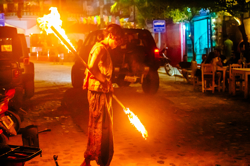 Sayulita, Nayarit Mexico, October 25 2023 street artist juggling fire with tourists on the streets of sayulita, nayarit