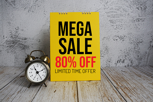 Mega Sale 80% off text message and alarm clock on wooden background