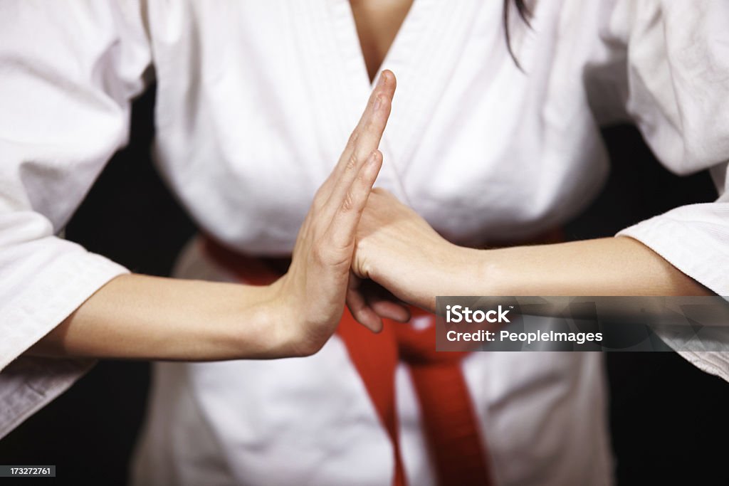 Bow of respect Young woman's fist pressed againt her palm bowing in respect - cropped isolated Judo Stock Photo