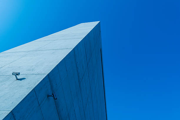 istock Big Brother. Surveillance camera on concrete building 173272816