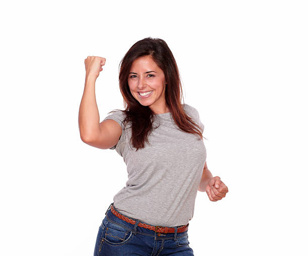 istock Happy smiling young woman celebrating a victory 173273011