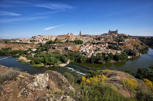 City view of Toledo on the Tagus River, Spain with the Cathedral and Alcazar at the background.