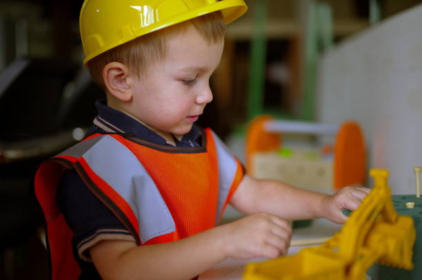 istock Toddler dressed as a builder playing at home 1732756901