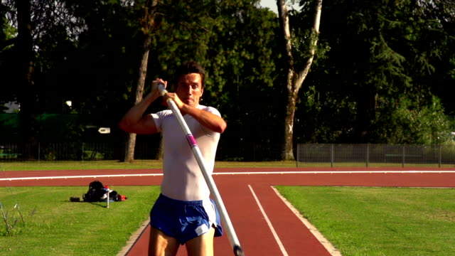 HD:Super Slo-Mo Shot of Young Athlete Performing at Pole Vault