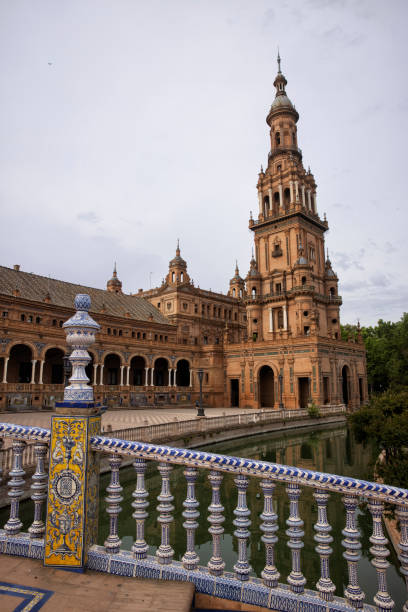 plaza de espana in sevilla, spanien - spain flag built structure cloud stock-fotos und bilder