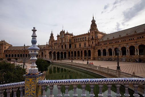 The Plaza de Espana, built in 1928, is a plaza in the Parque de Maria Luisa in Seville, Spain. Composite photo