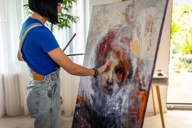 istock Artist painting on canvas by hand 1732795354