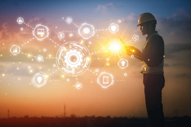 Engineer using tablet to inspect work at job site. concept of technology usage In industrial applications, remote data retrieval, large databases. network link.