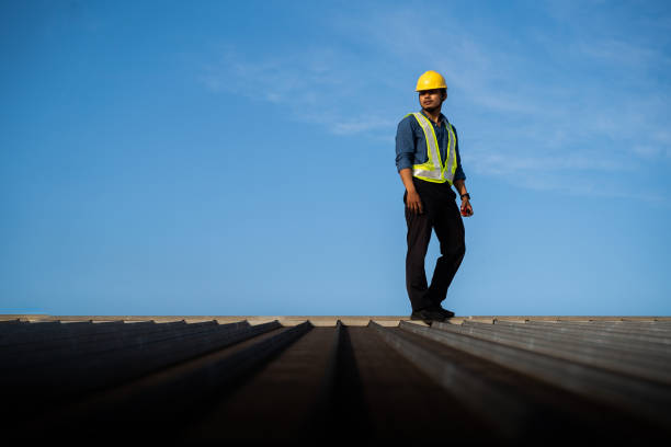 istock Engineer on a construction site at sunset. Working on the roof . 1732838057