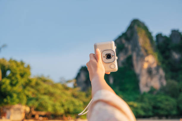 POV Solo travel asian travel capture sunset with Polaroid selfies time in krabi phi phi thailand