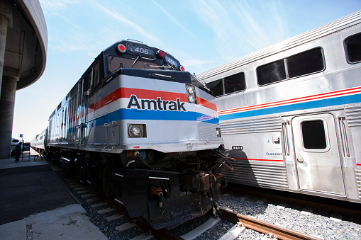 Los Angeles, California, USA - July 16, 2023: An Amtrak passenger train engine pulls into Union Station.