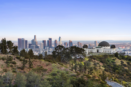 Griffith Observatory with downtown Los Angeles in the background  at twilight with cityscape