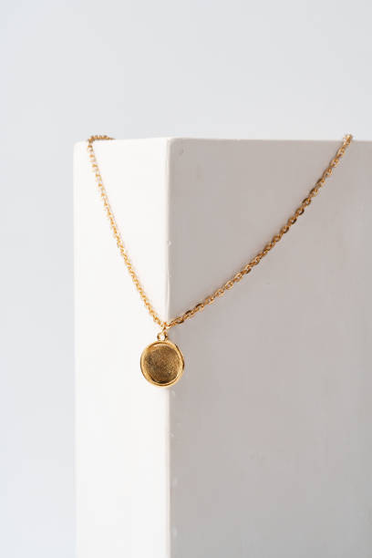 istock Golden pendant on chain on white background studio shot 1732904510