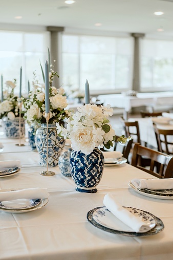 A traditional wedding reception with a beautiful blue china dinnerware setting