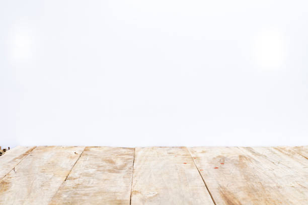 istock Wooden floor with white wall blank studio. Space for text. 1732922242