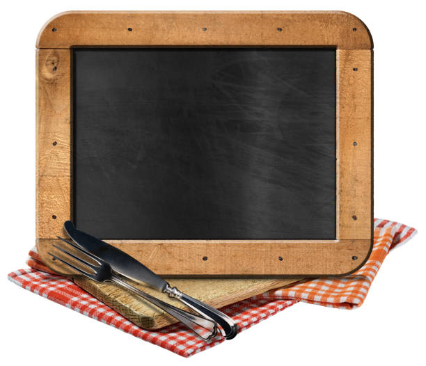 istock Empty Blackboard and Silver Cutlery above a Wooden Cutting Board 1732937111