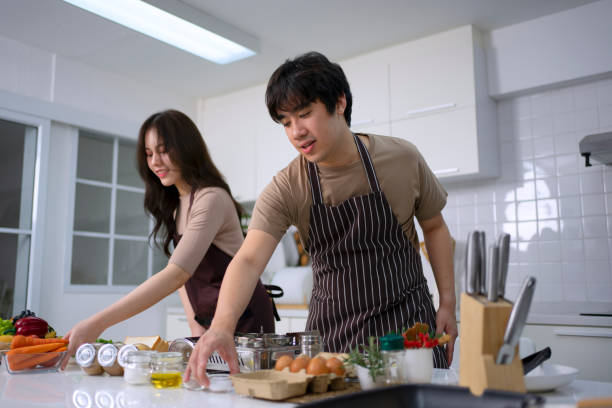 istock Young couple is cooking in kitchen. 1732946349