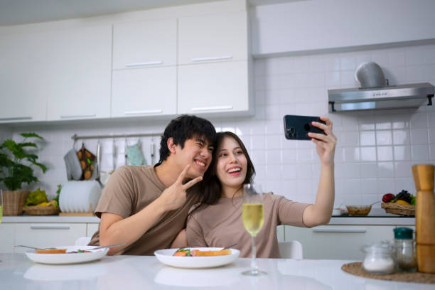 istock Young couple is shopping online in kitchen. 1732946864