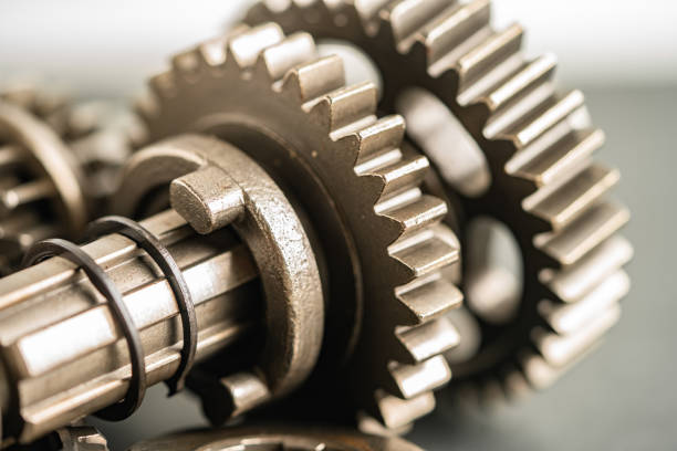 istock Gear and cogs wheels, clock mechanism, brass metal engine industrial. 1732956141